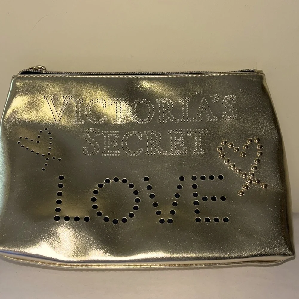 Gold Victoria’s Secret cosmetics/ small carrying bag with handle, studded heart