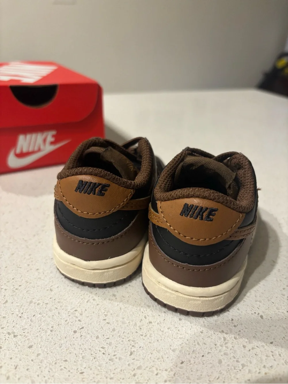 Nike Kids Low-Top Sneakers in Brown and Black with Tan Swoosh