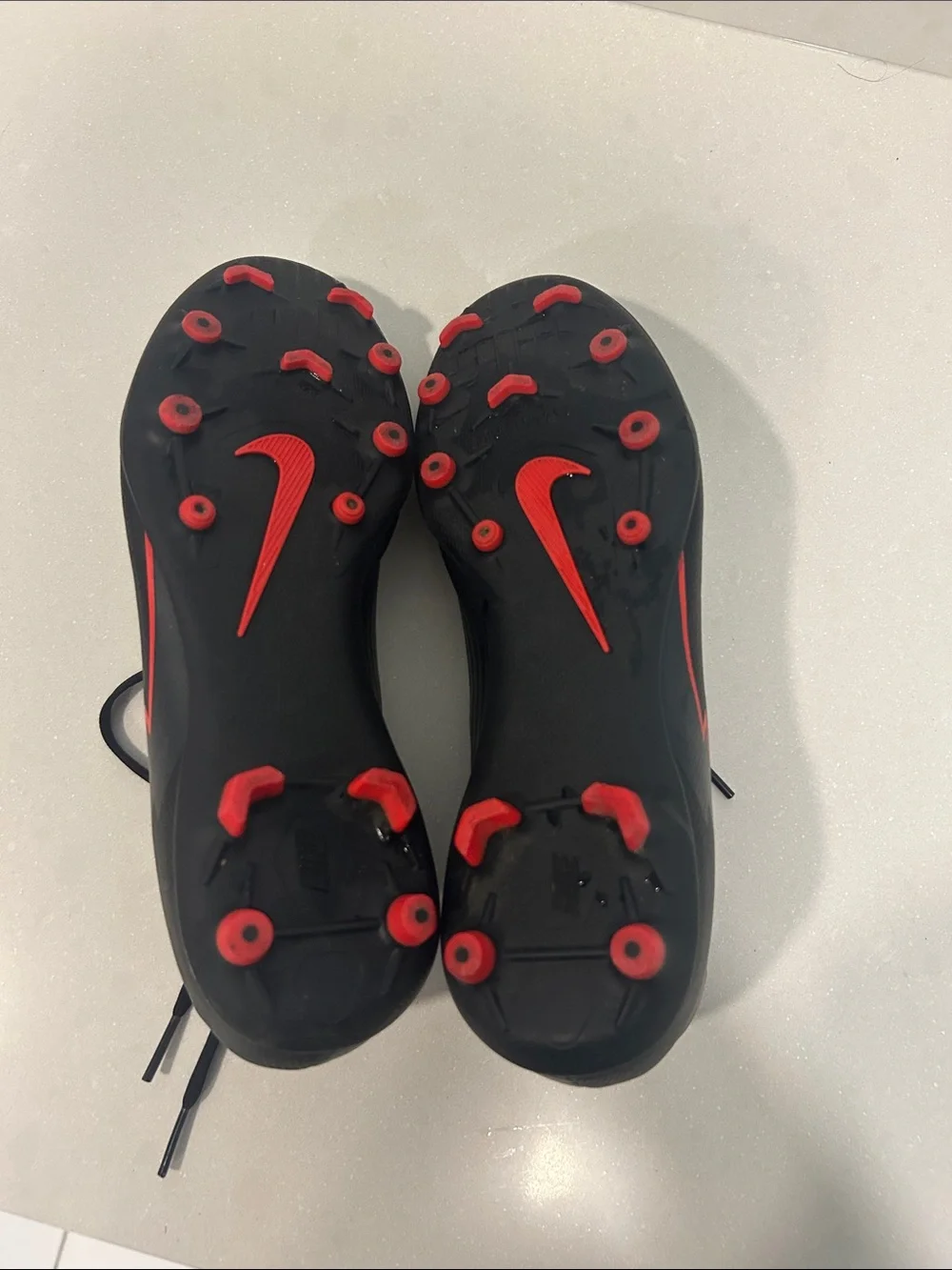Kids Black Soccer Cleats with Red Accents