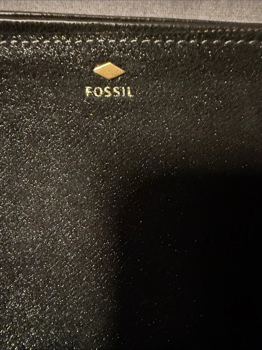 Fossil sleek zip