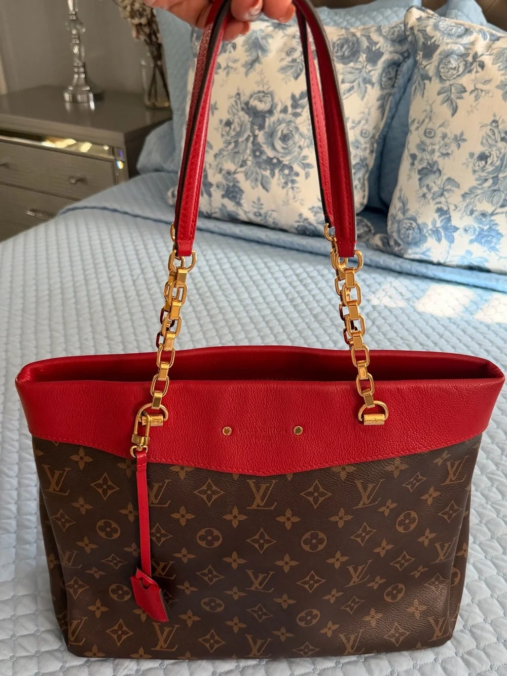 Louis Vuitton Pallas Shopper Tote in Monogram with Red trim.