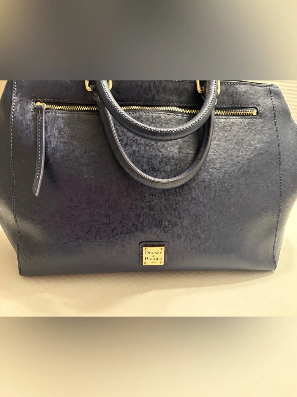 Dooney & Bourke adjustable pockets
