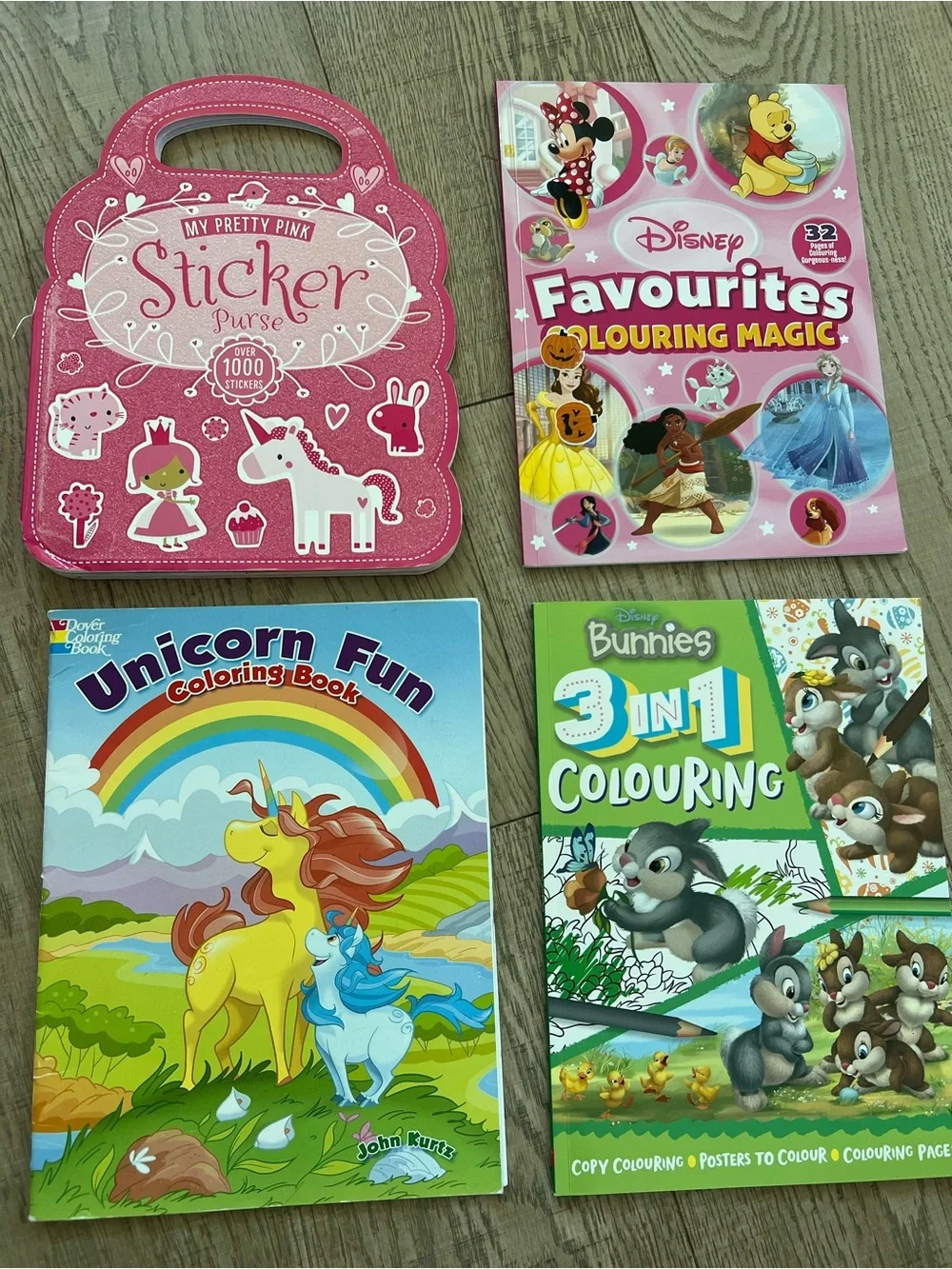 4 coloring books - 2 x Disney, 1 x Unicorns, 1 x Pink Purse.