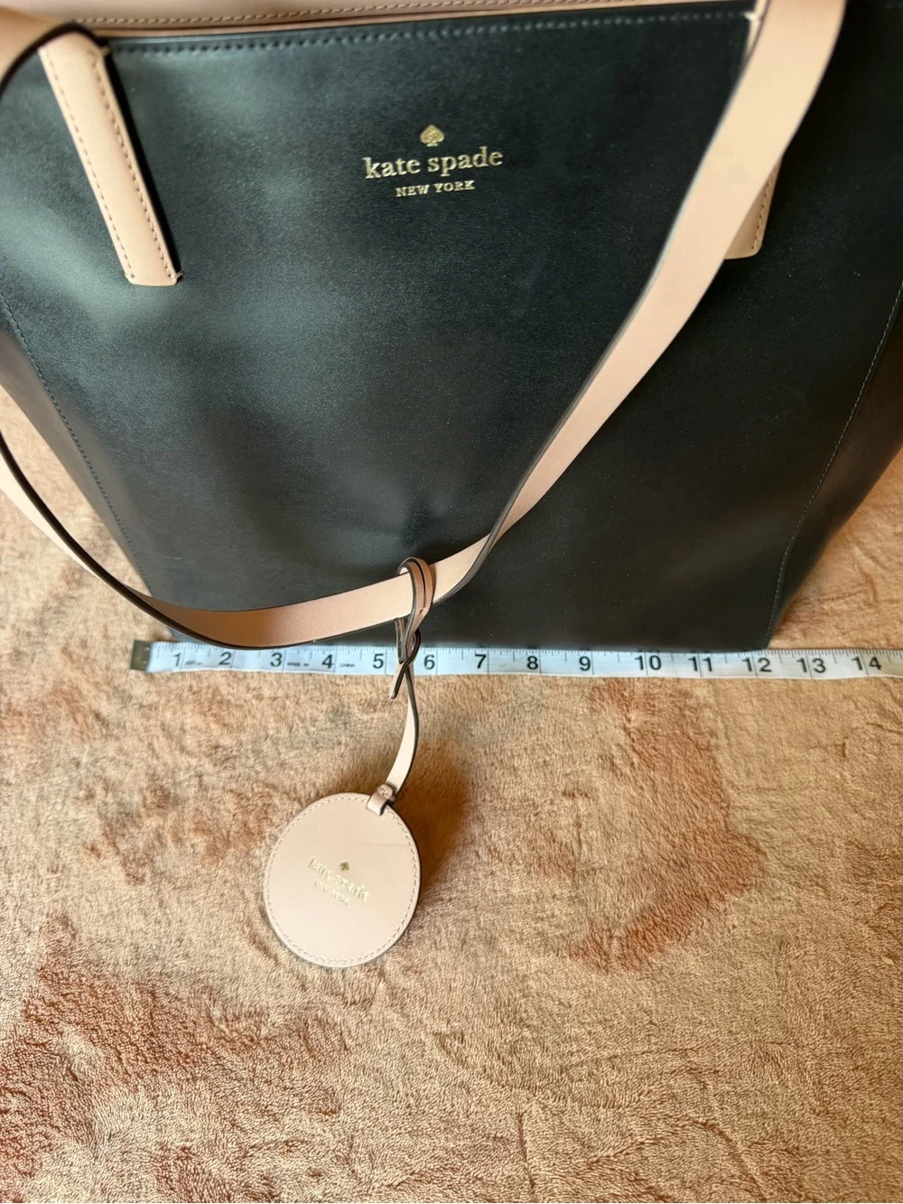 kate spade black tote with cream straps and floral charm