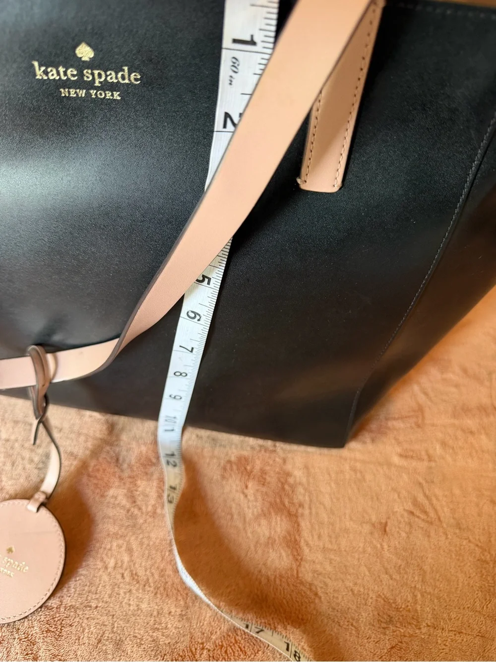 kate spade black tote with cream straps and floral charm