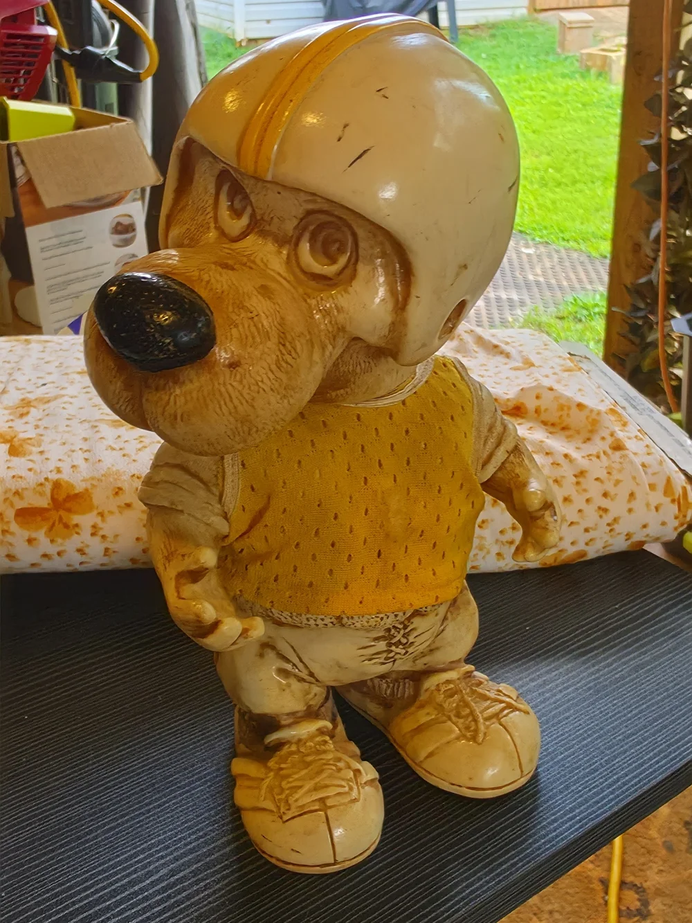 Vintage Dog Figurine Wearing Helmet - Yellow Accent