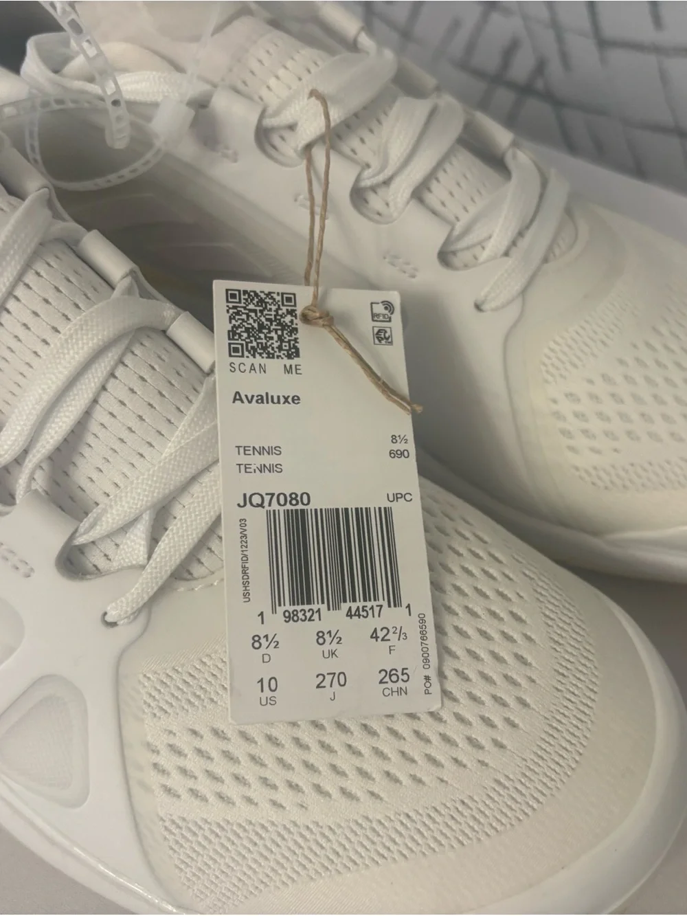 adidas Avaluxe tennis shoes in white with subtle pastel yellow accents. JQ7080