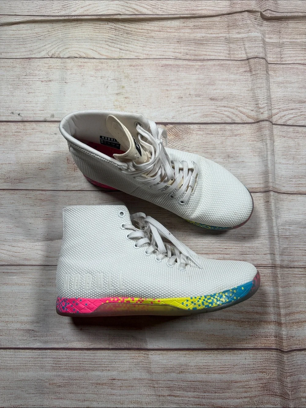 NOBULL‎ white high-top trainers featuring a vibrant multi-color glitch sole