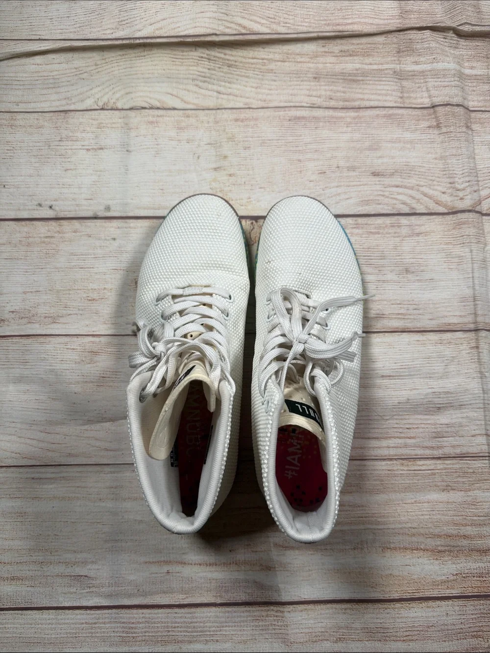 NOBULL‎ white high-top trainers featuring a vibrant multi-color glitch sole