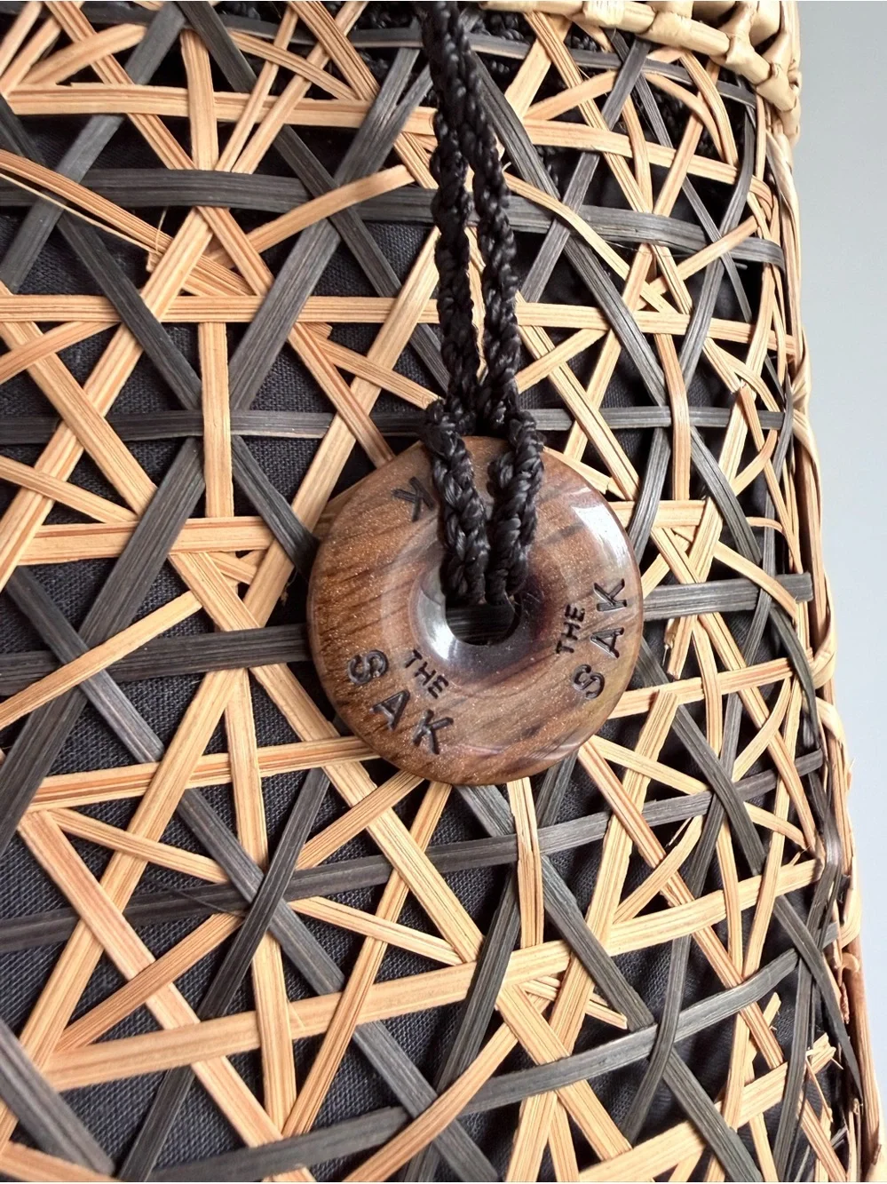 The Sak Woven Rattan Basket Drawstring Tote Purse