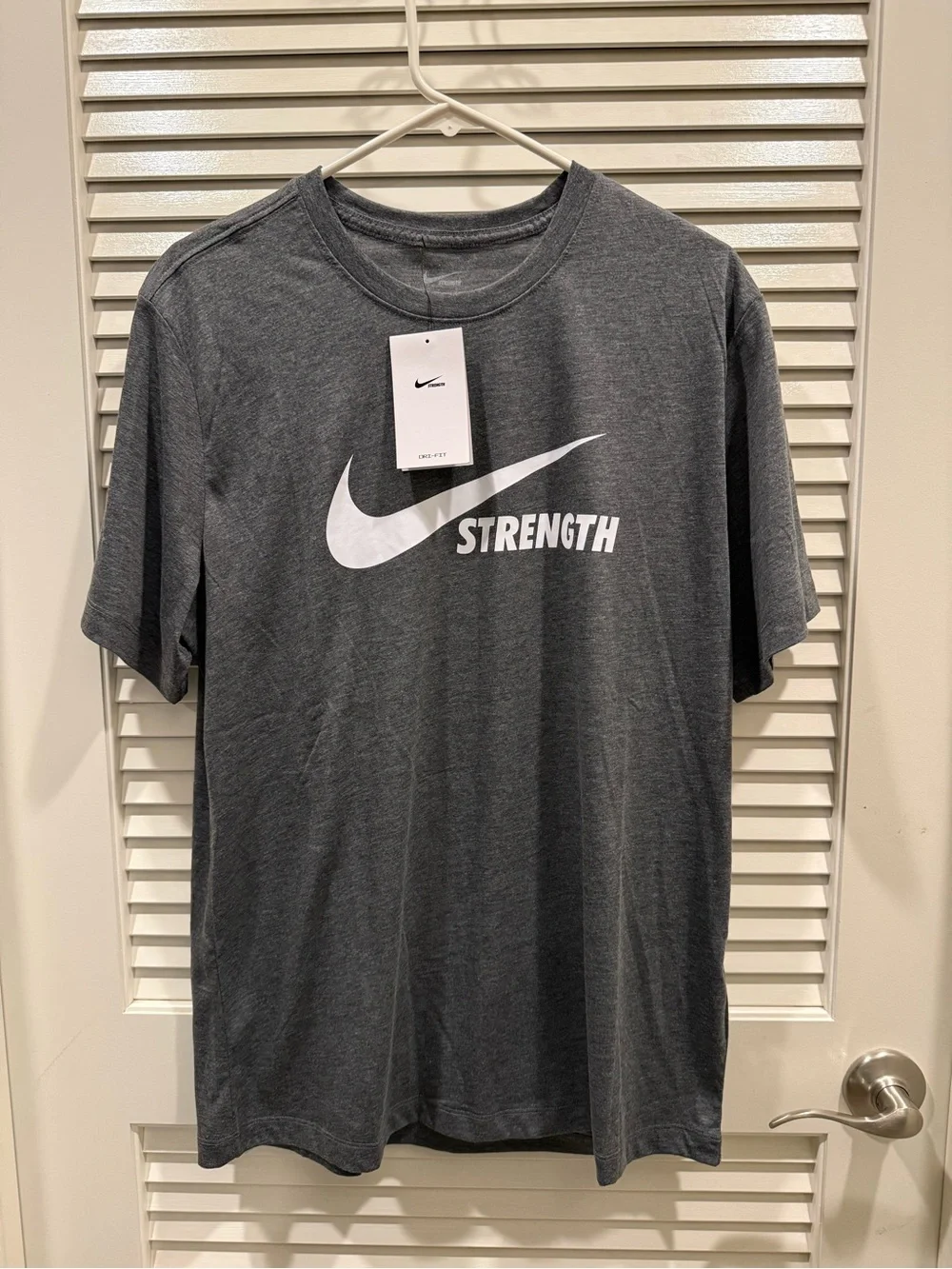 Nike Gray 'Strength' Short Sleeve Crew Tee with White Swoosh