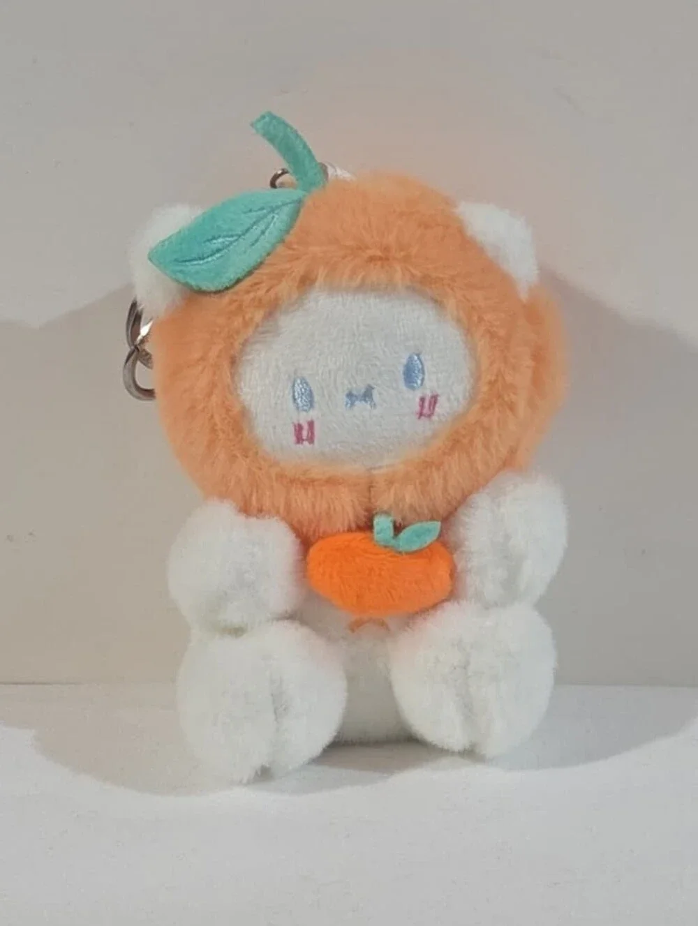 white bear with orange hat plushie keychain