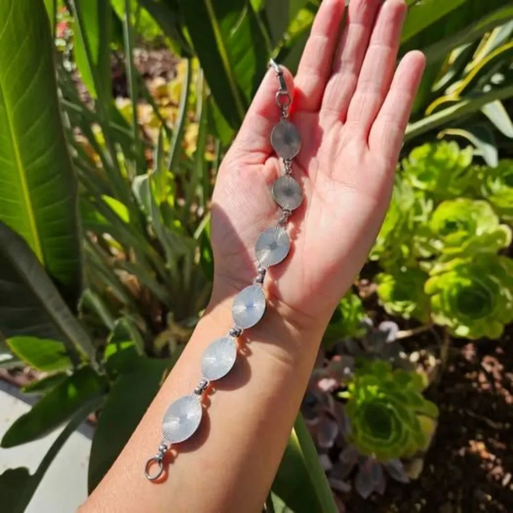 Malachite bracelet features natural green gemstones set in a silver colored link