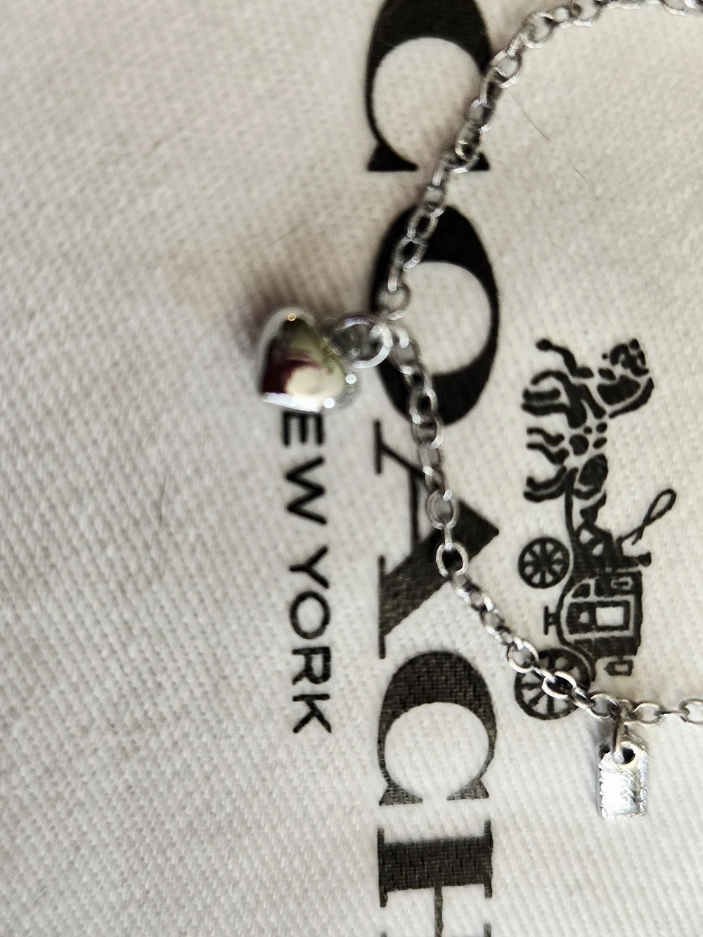 Coach Silver Charm Bracelet with Heart Accents
