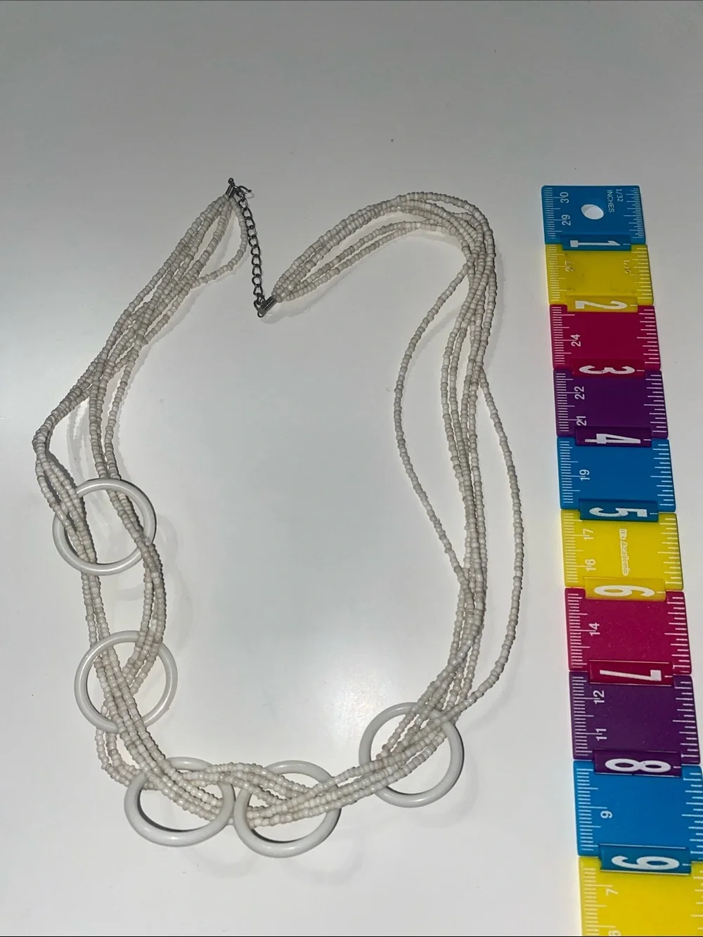White Multi-Strand Beaded Necklace with Ring Accents