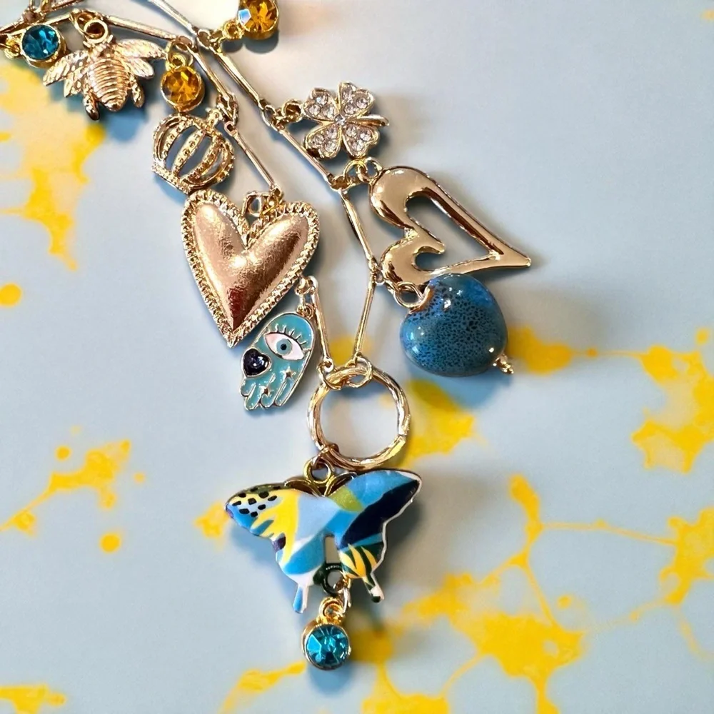 Unique and Gorgeous Gold toned Necklace with Varying Blue and Yellow Charms