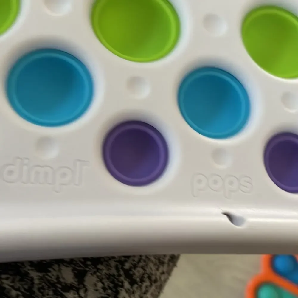 Hard plastic dimple pop perfect for babies sanitizable like new 4 total fodgets