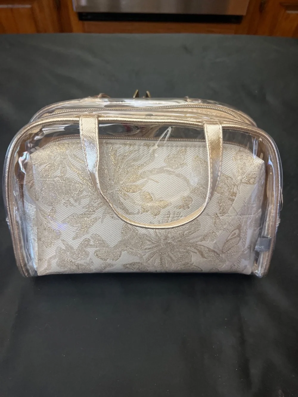 NWT Vince Camuto Clear PVC/Floral/Gold 3 Piece Make /Up bag Set.