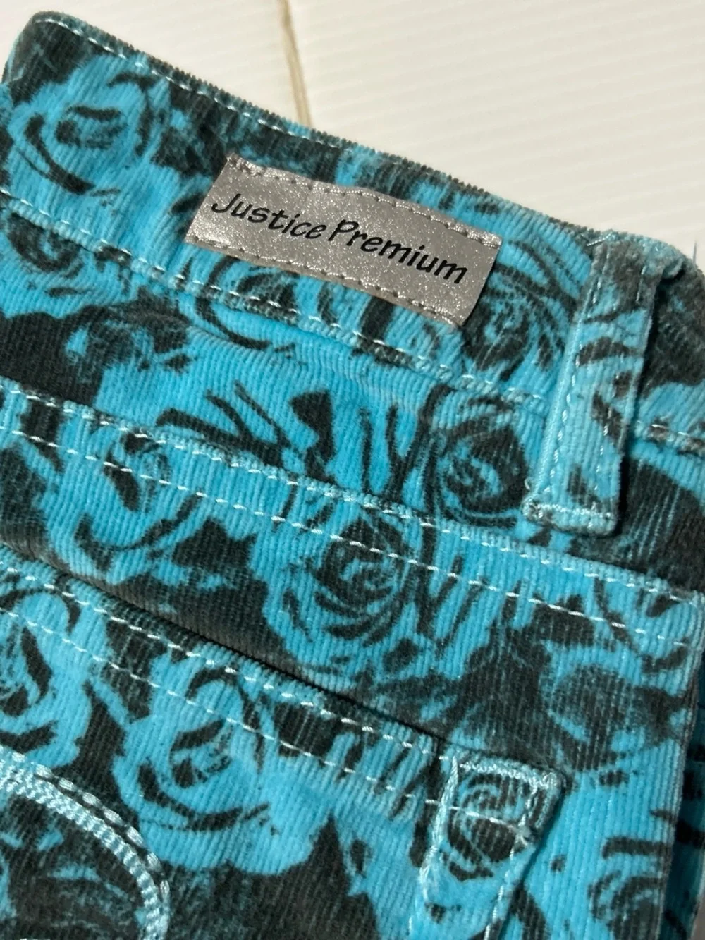 Justice Girls Teal and Black Rose Print Jeans