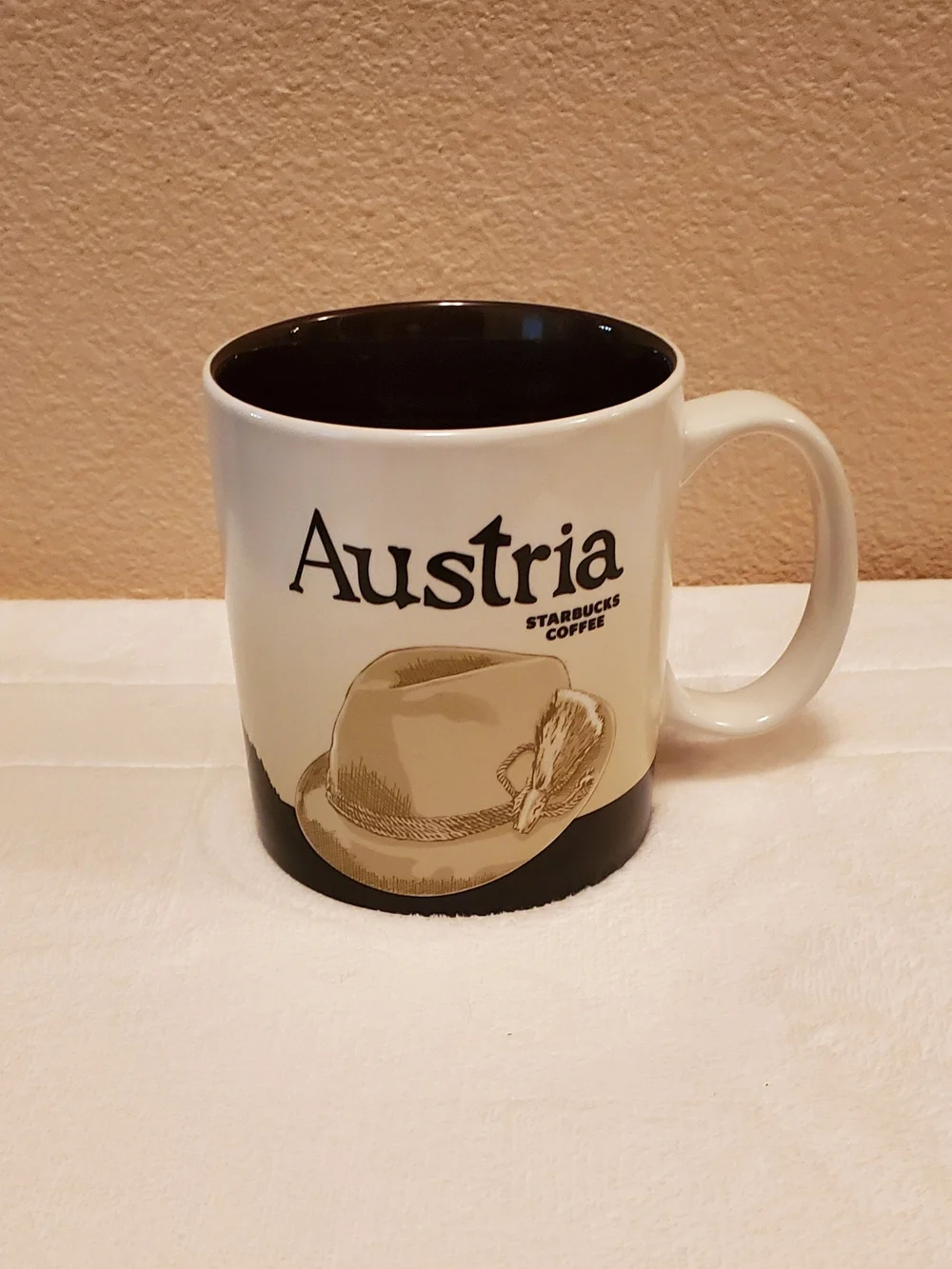 Starbucks Austria Souvenir Mug in Cream & Brown with Tan Hat Artwork