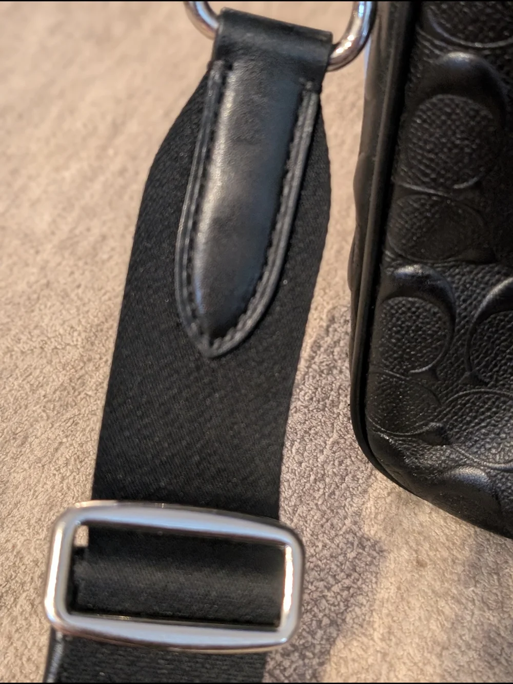 Coach embossed secure closure