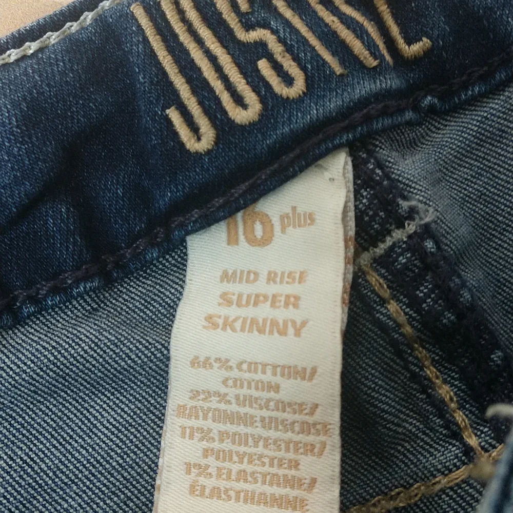 Justice mid rise skinny jeans. Size 16 plus