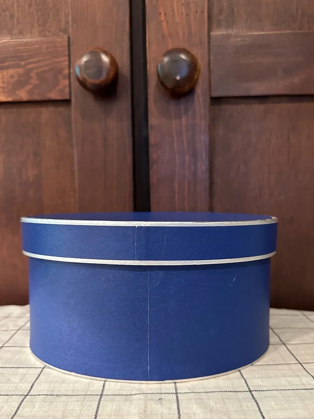 Heavy cardboard • oval lidded box • in new condition • blue w/silver trim