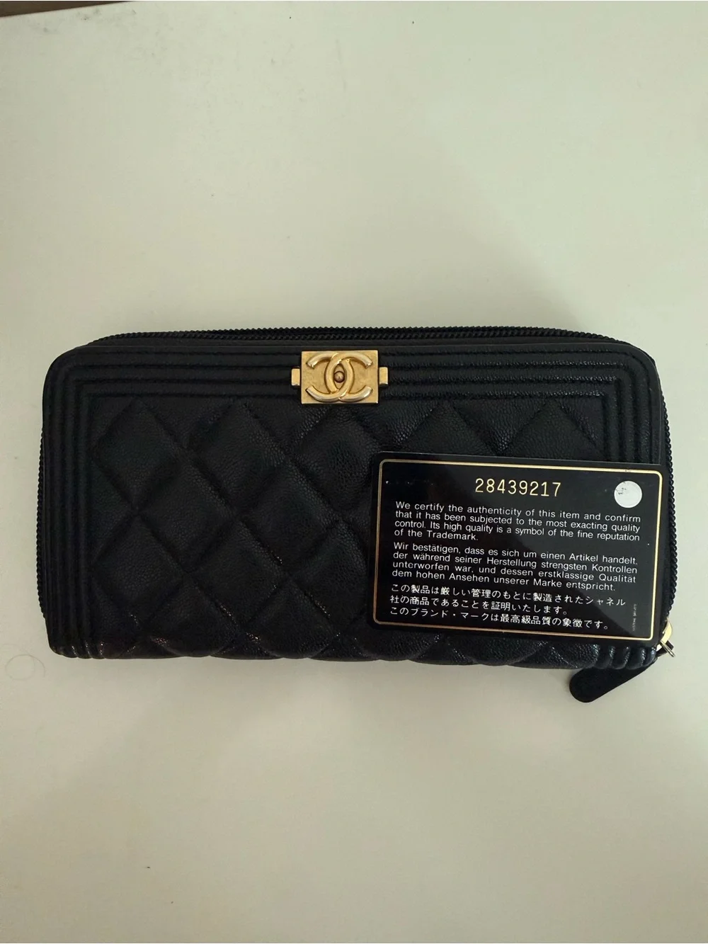 CHANEL Black Quilted Zip-Around Wallet with Gold CC Lock
