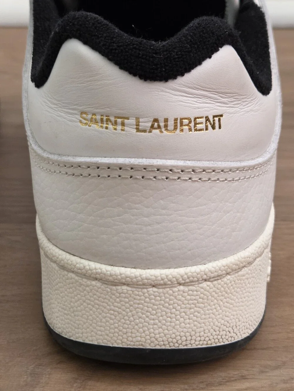 Saint Laurent perforated signs