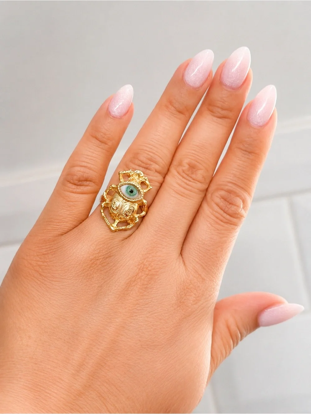 Gold Filigree Ring with Green Eye Accent