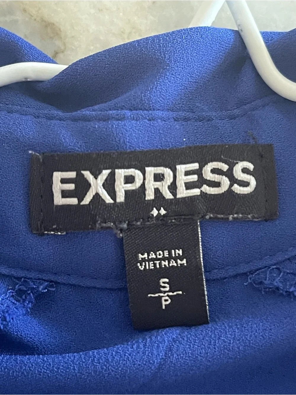 Express sleeveless button