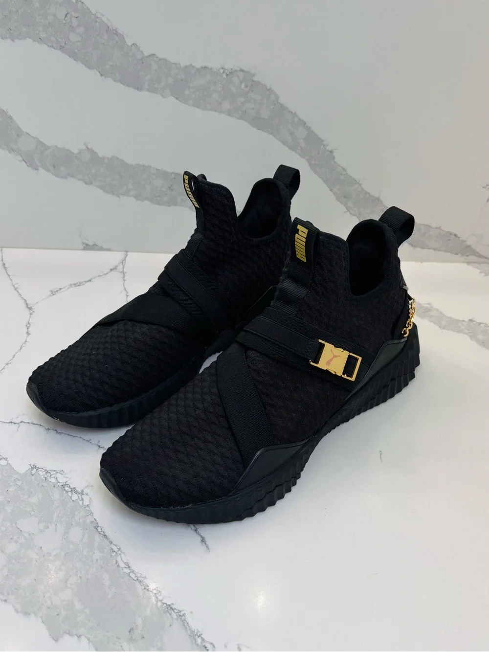 PUMA Women’s 10 Defy Mid Black Training Sneakers with Gold Buckle and Chain