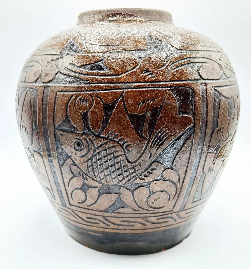 Vintage Asian Pottery Jar featuring designs of Fish, Bird, and Flowers