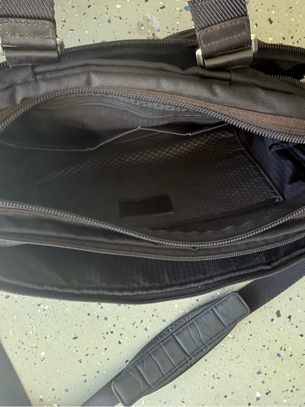 Tumi multiple metal trimmed