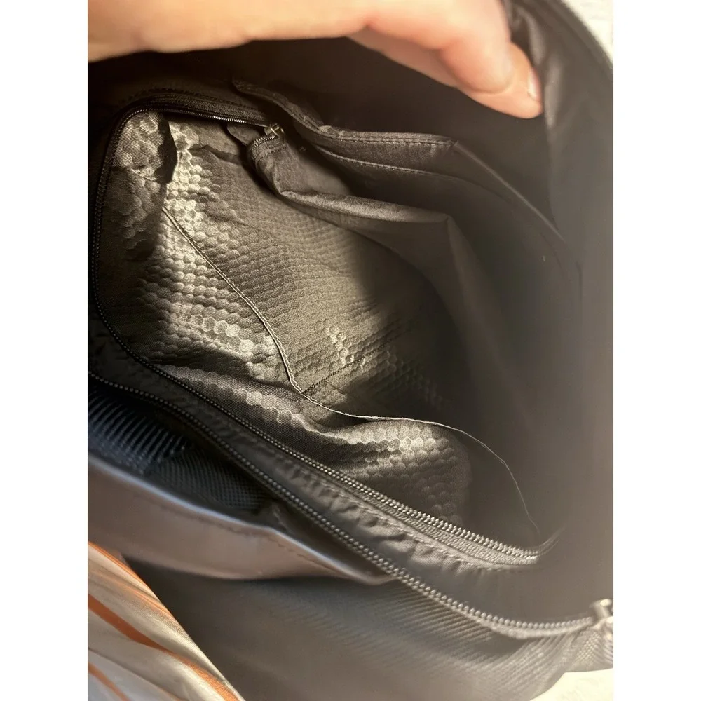Tumi Black Nylon Backpack with Brown Leather Base and Trim
