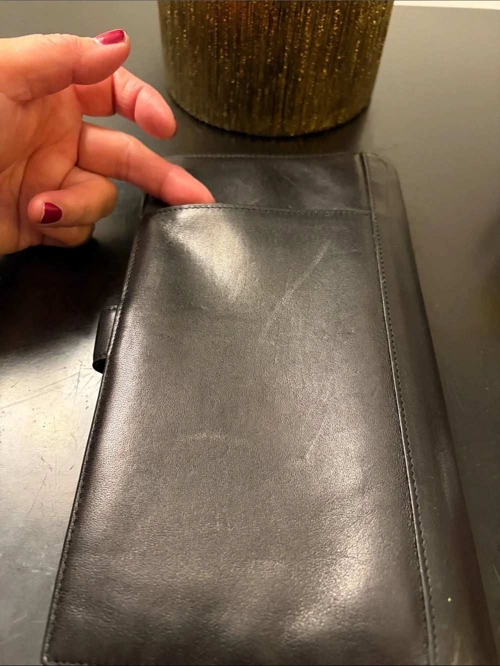 Tumi Black Leather Trifold Travel Wallet with Red Logo (9x5 in.)