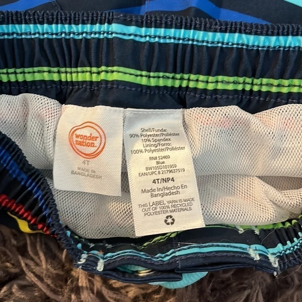 Wonder nation size 4T swim trunks.  Blue background with colorful stripes