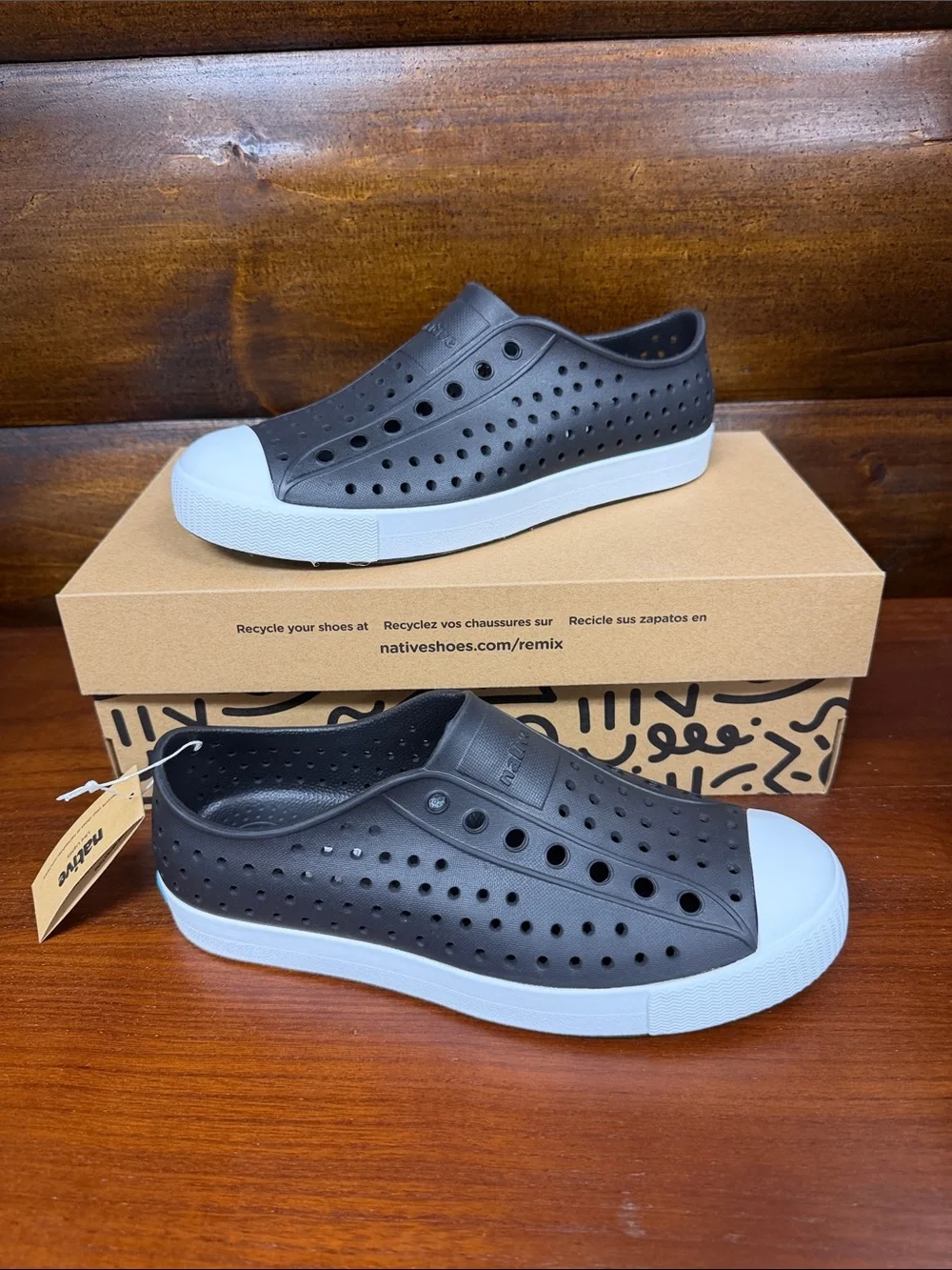 Kids Native Slip-On Perforated Sneakers in Black and White