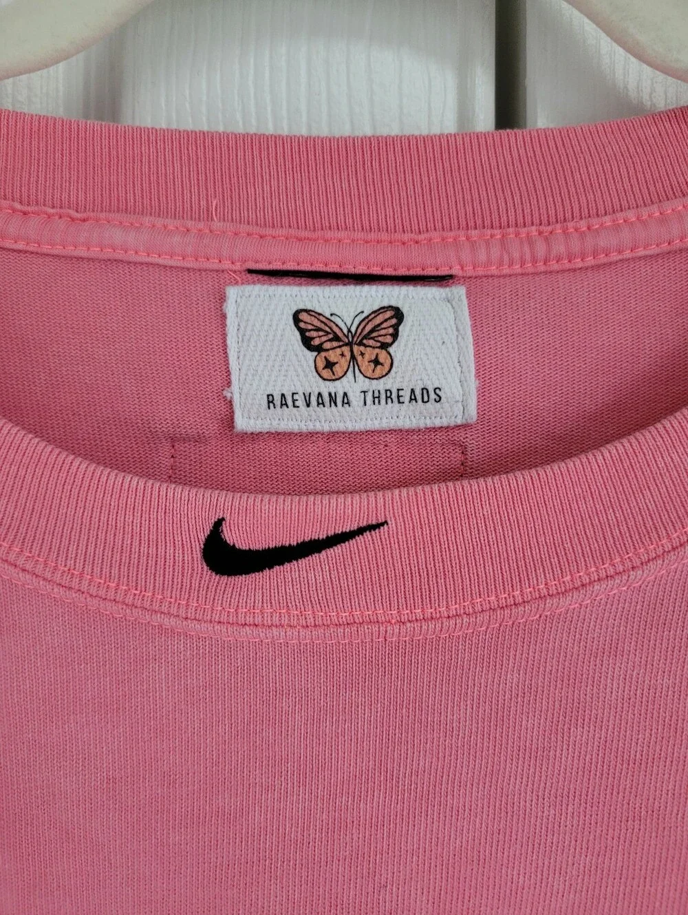Nike Pink Sweatshirt with Black & White Checkerboard Sleeves