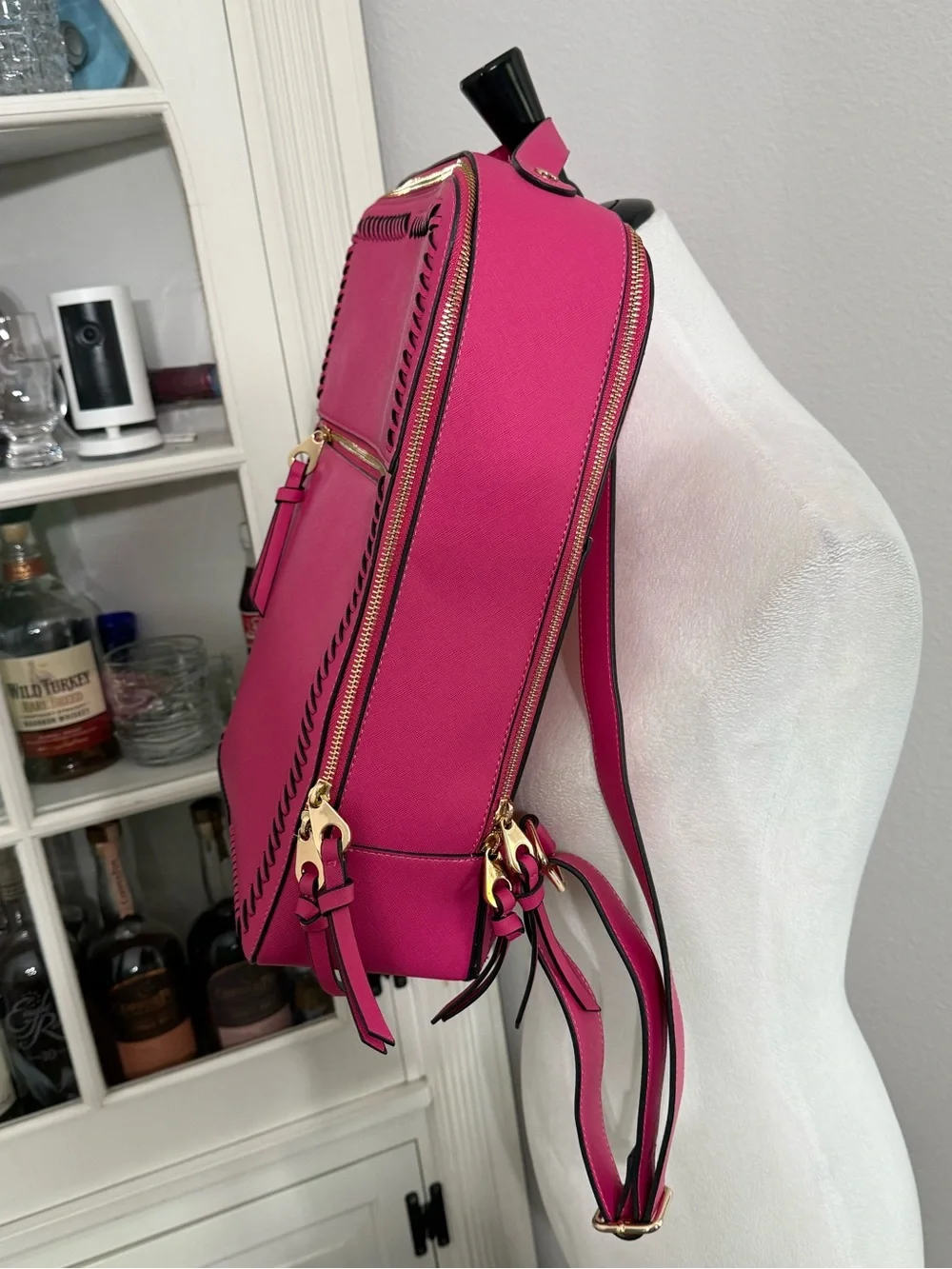 CALPAK Kaya Laptop Backpack in the vibrant Dragonfruit hot pink