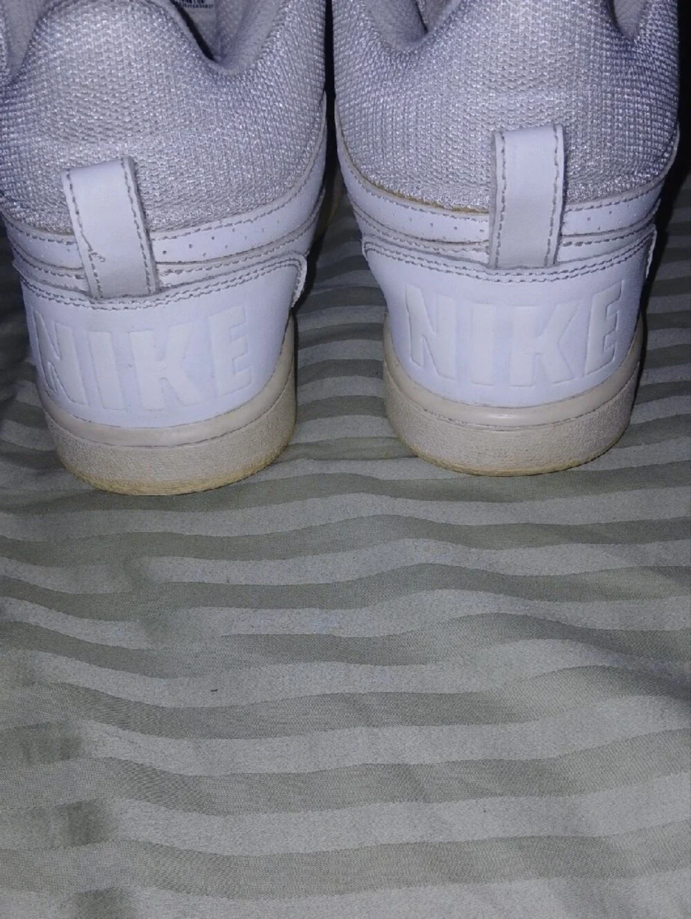 Nike swoosh high