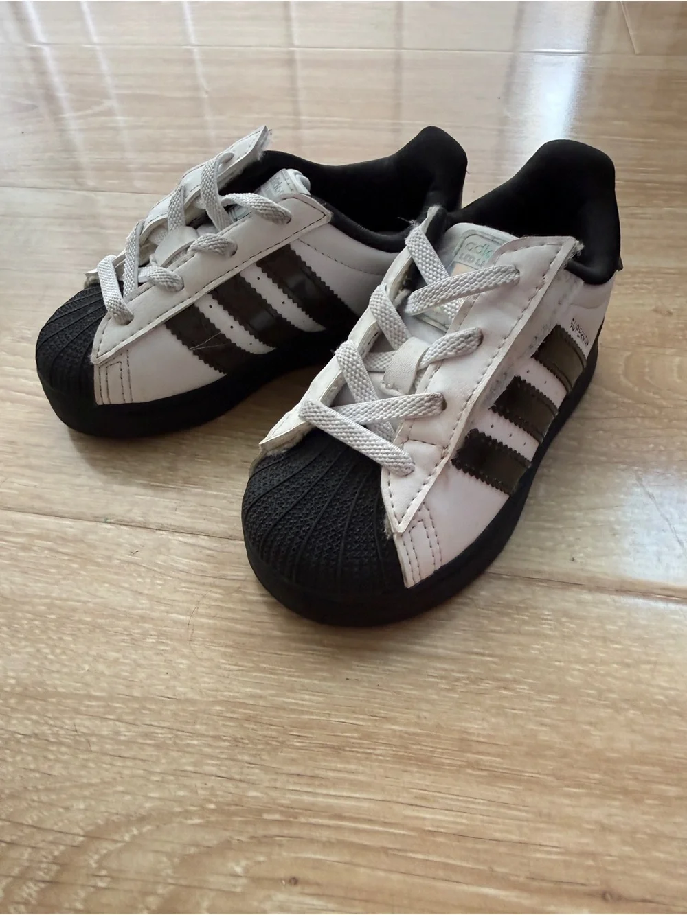 adidas Kids Superstar Sneakers in White, Black and Rainbow Lights