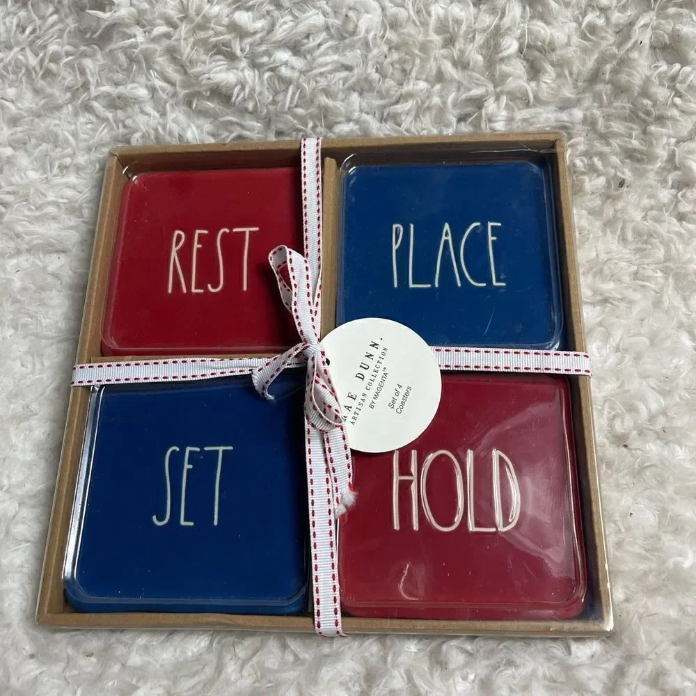 New in box Rae Dunn Ceramic Red & Blue Rest, Place, Stay, Hold Coasters .