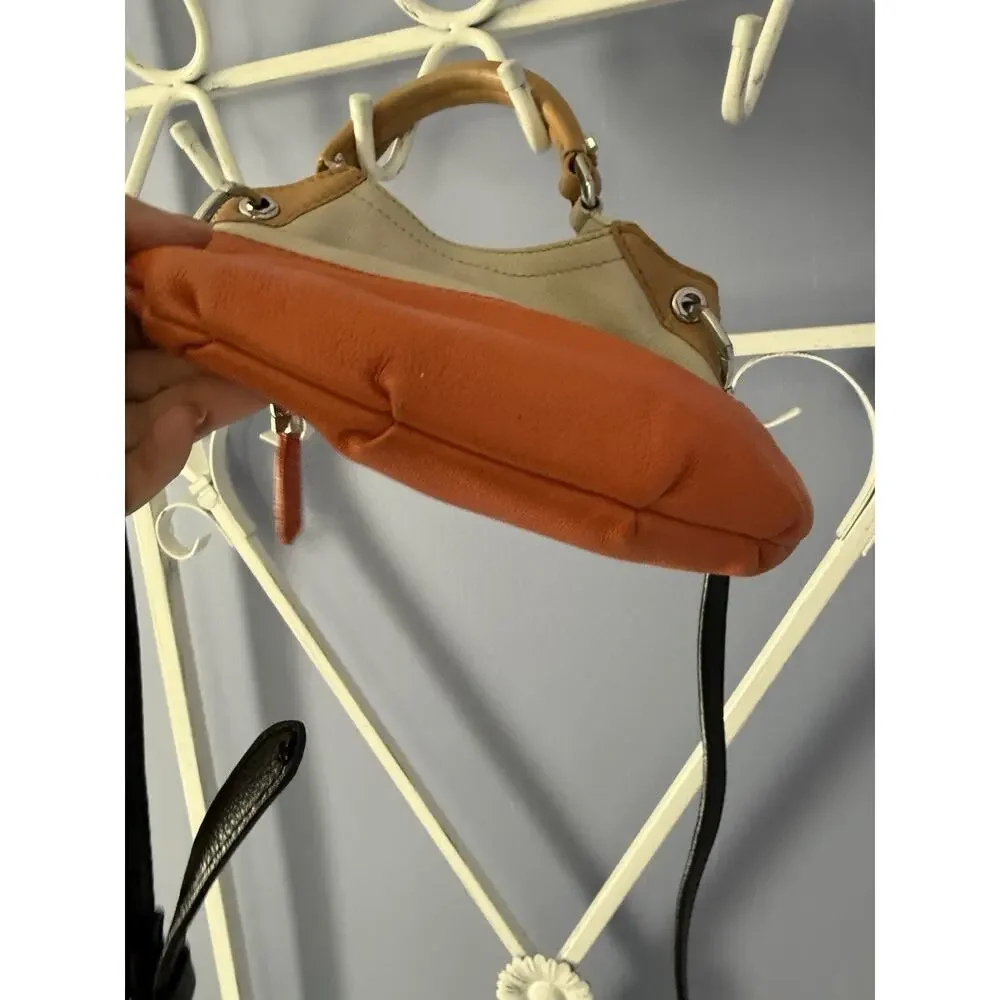 OrYANY Beige leather bag orange accents and a black strap Crossbody