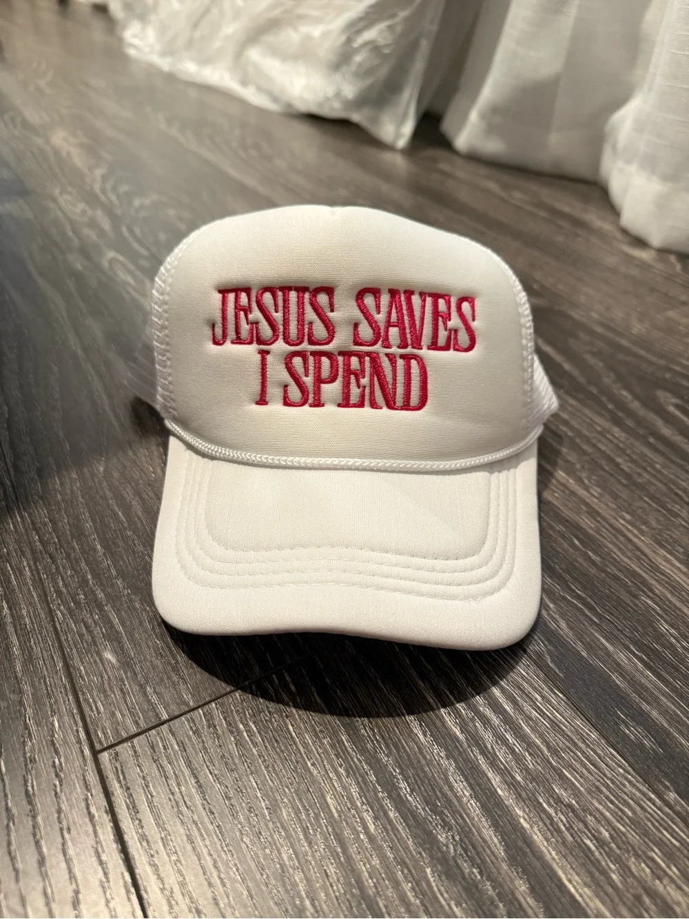 White Trucker Hat with Red Embroidery - 'Jesus Saves I Spend'