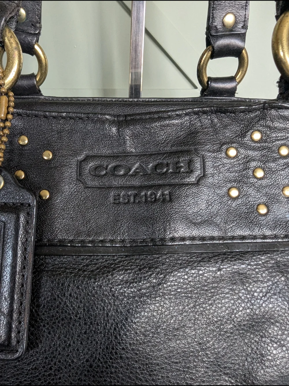 Coach Black Leather Shoulder Bag with Gold Stud Accents