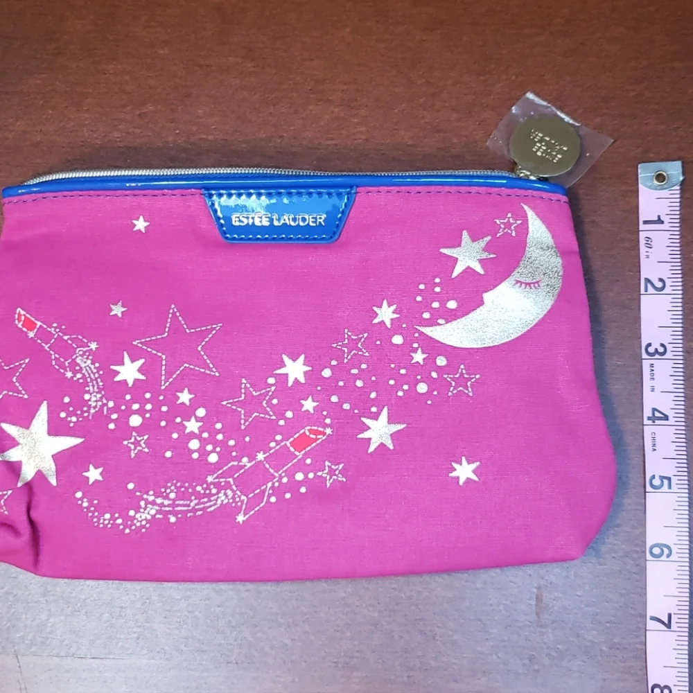 Estee Lauder clutches coin approximately