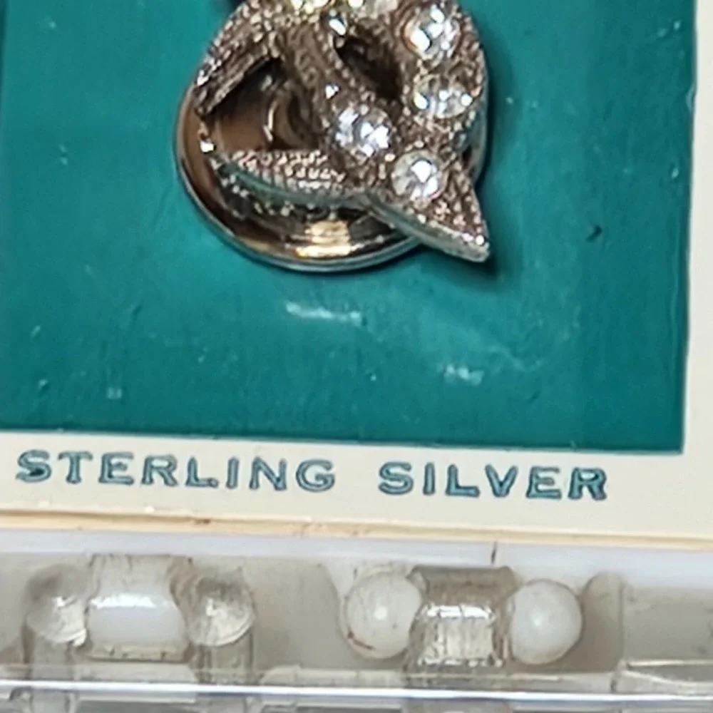 Crescent saber rhinestone flaws
