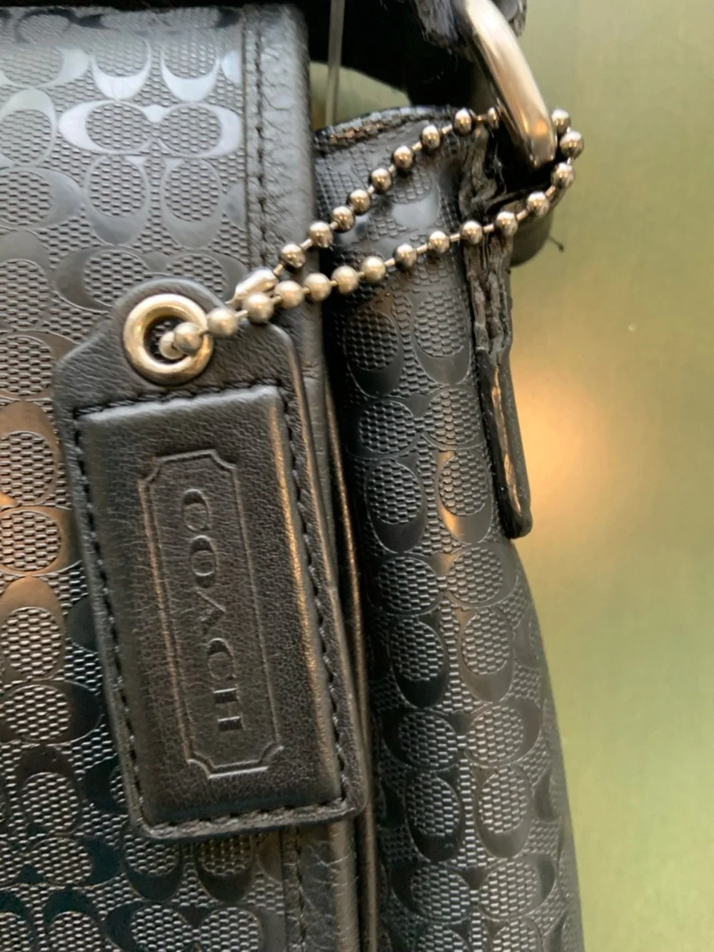 Coach sleek black