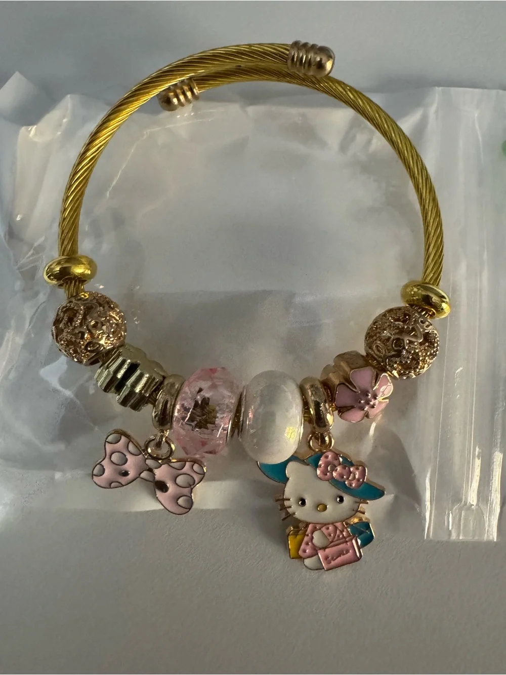 Hello Kitty Gold-Tone Charm Bracelet - Pink Accents